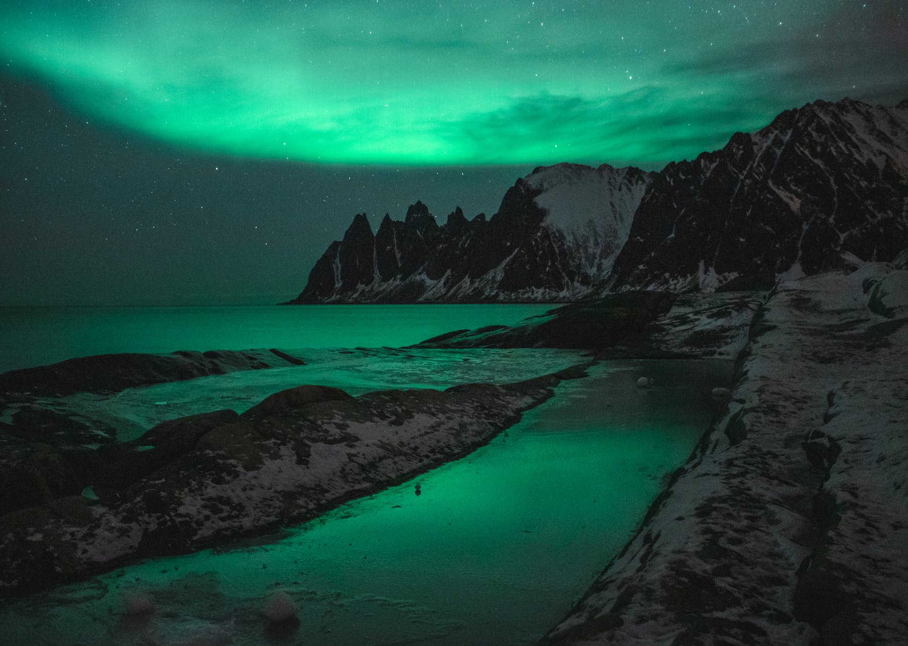 rocky mountains and aurora borealis