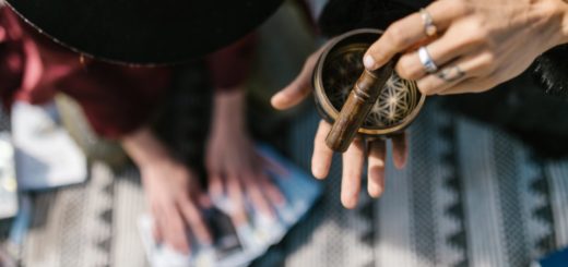 a hand using tibetan singing bowl