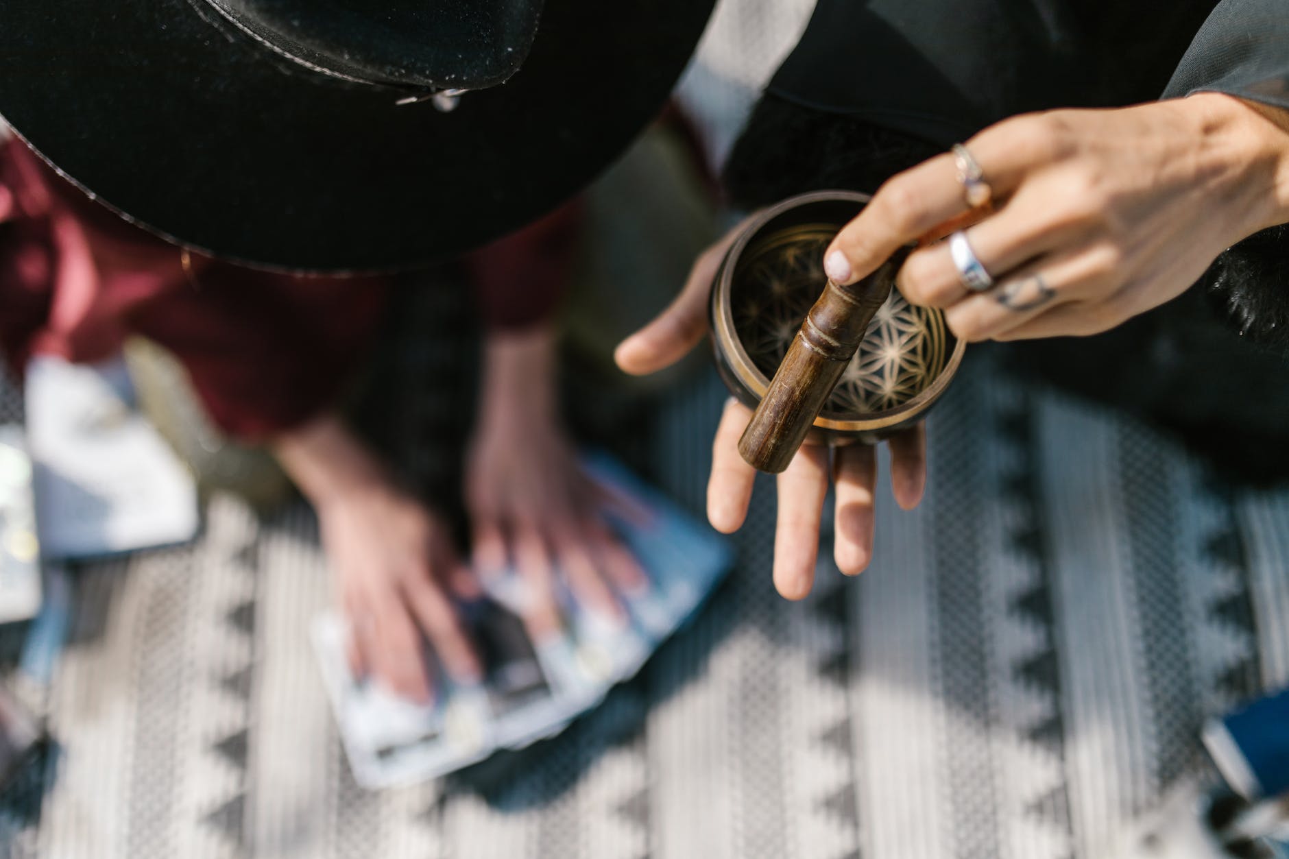 a hand using tibetan singing bowl