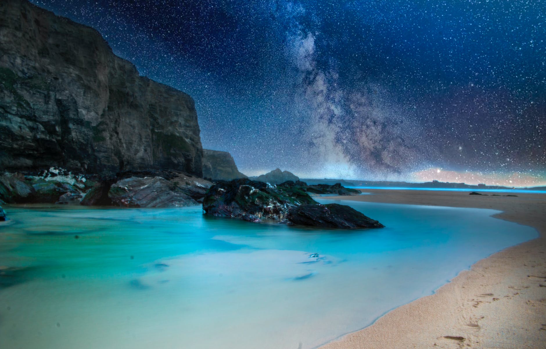 black stone on body of water during nighttime