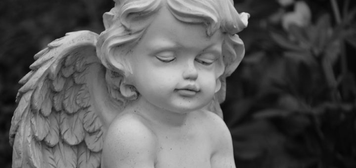 close up photo of an angel figurine