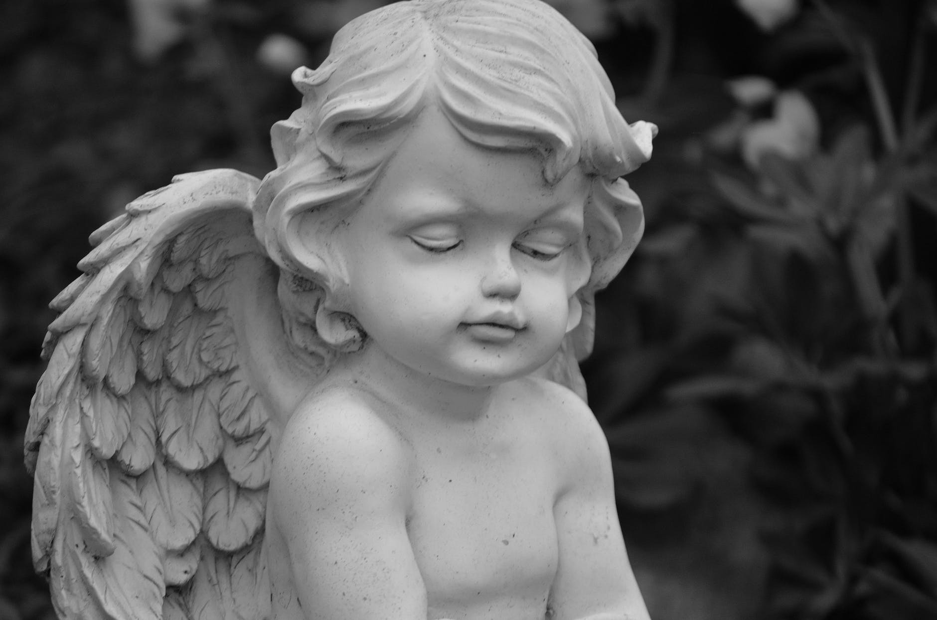 close up photo of an angel figurine