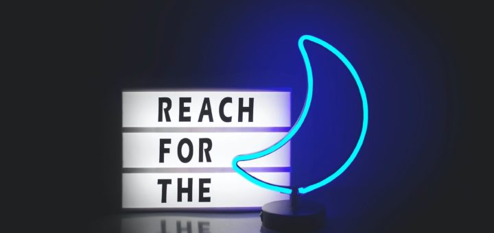 reach for the and blue moon neon signages