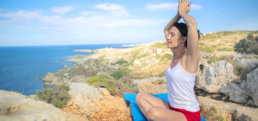 woman in white tank top doing yoga exercise