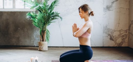 woman meditating with candles and incense