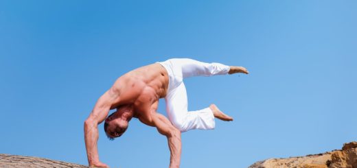 man wearing white pants under blue sky