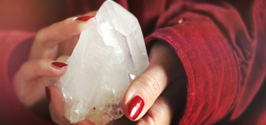 close up photo of person holding crystal stone