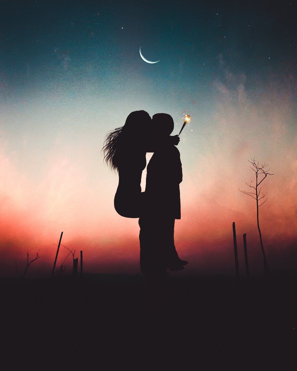 silhouette of kissing couple