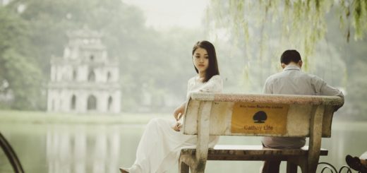 woman sitting on bench outdoors