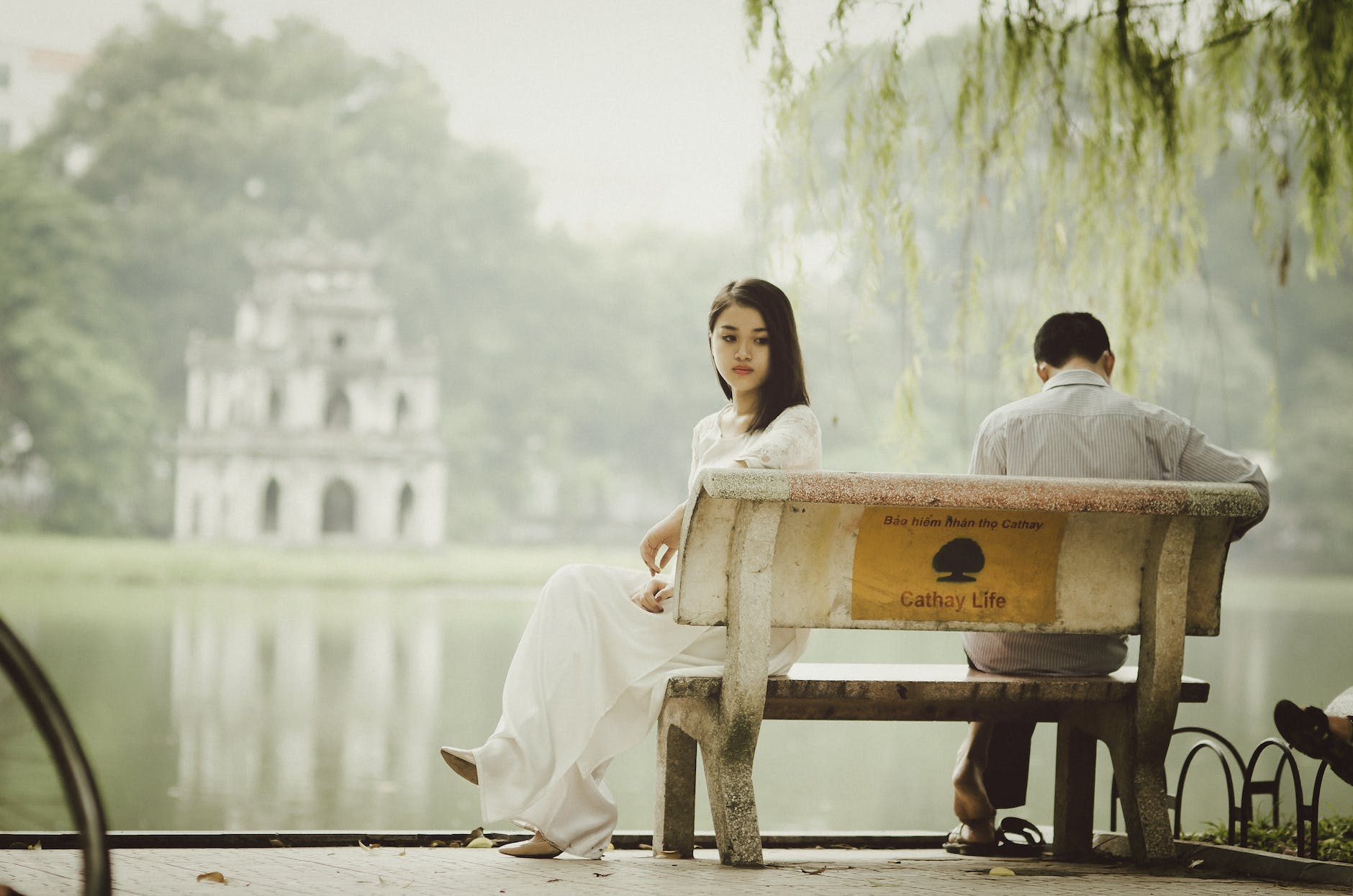 woman sitting on bench outdoors