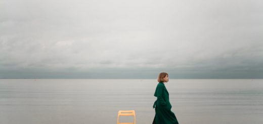 person walking on seashore