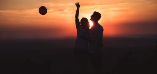 silhouette photo of couple standing outdoors