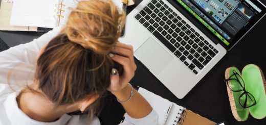 woman sitting in front of macbook