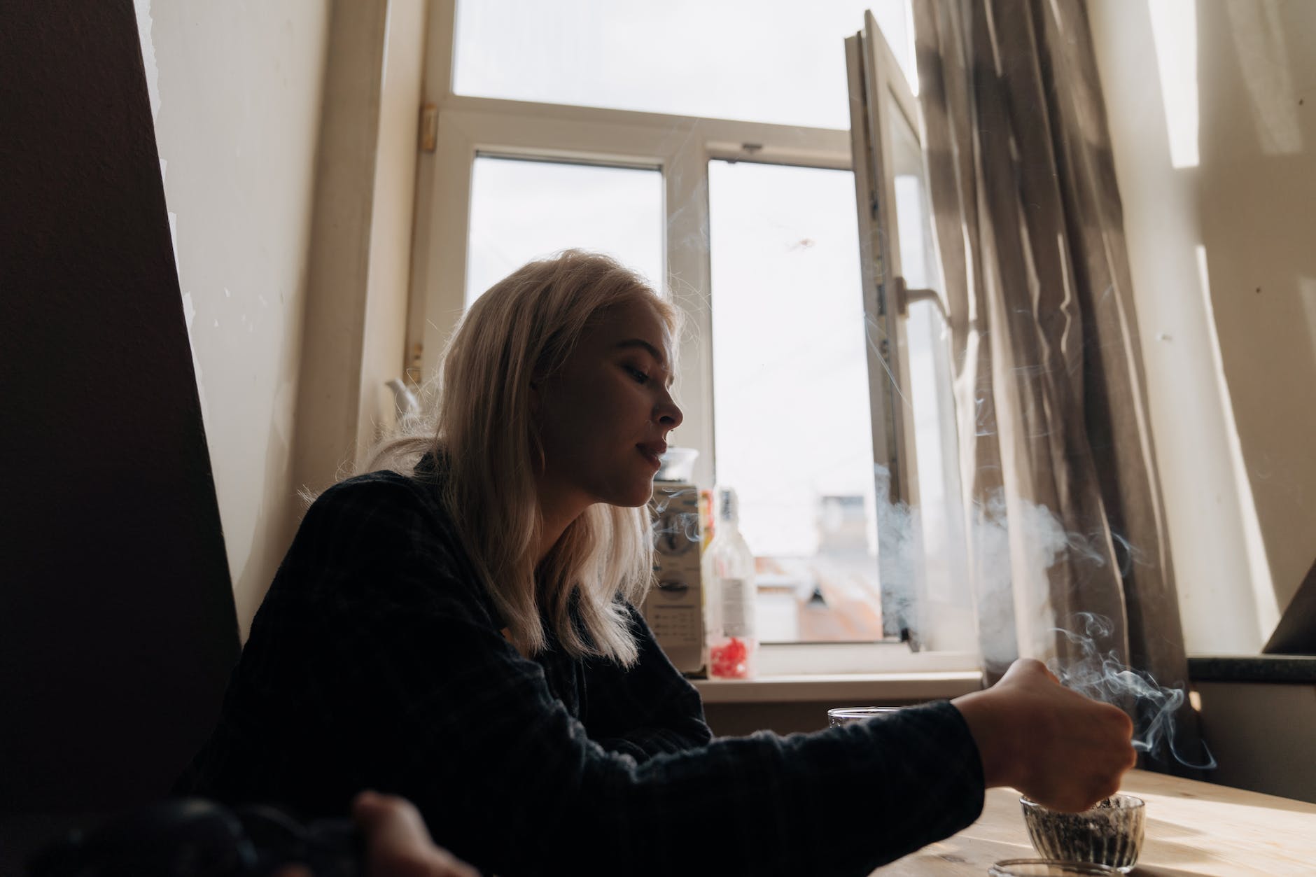 a woman smoking a cigarette