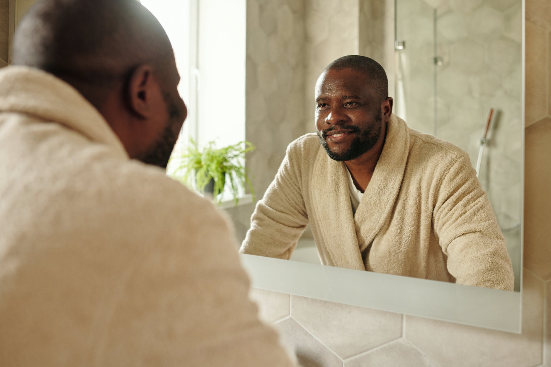 a man looking at a mirror