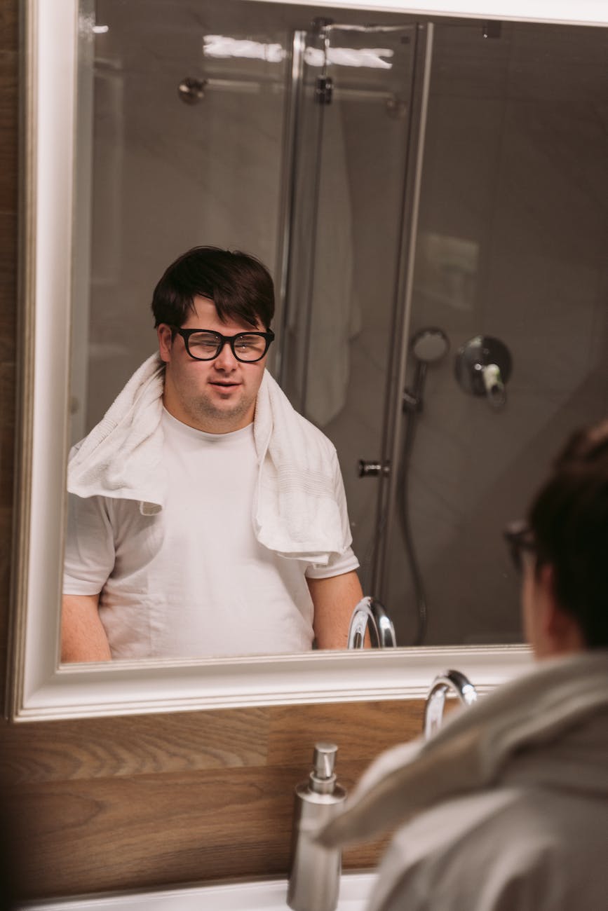 a man looking at a mirror