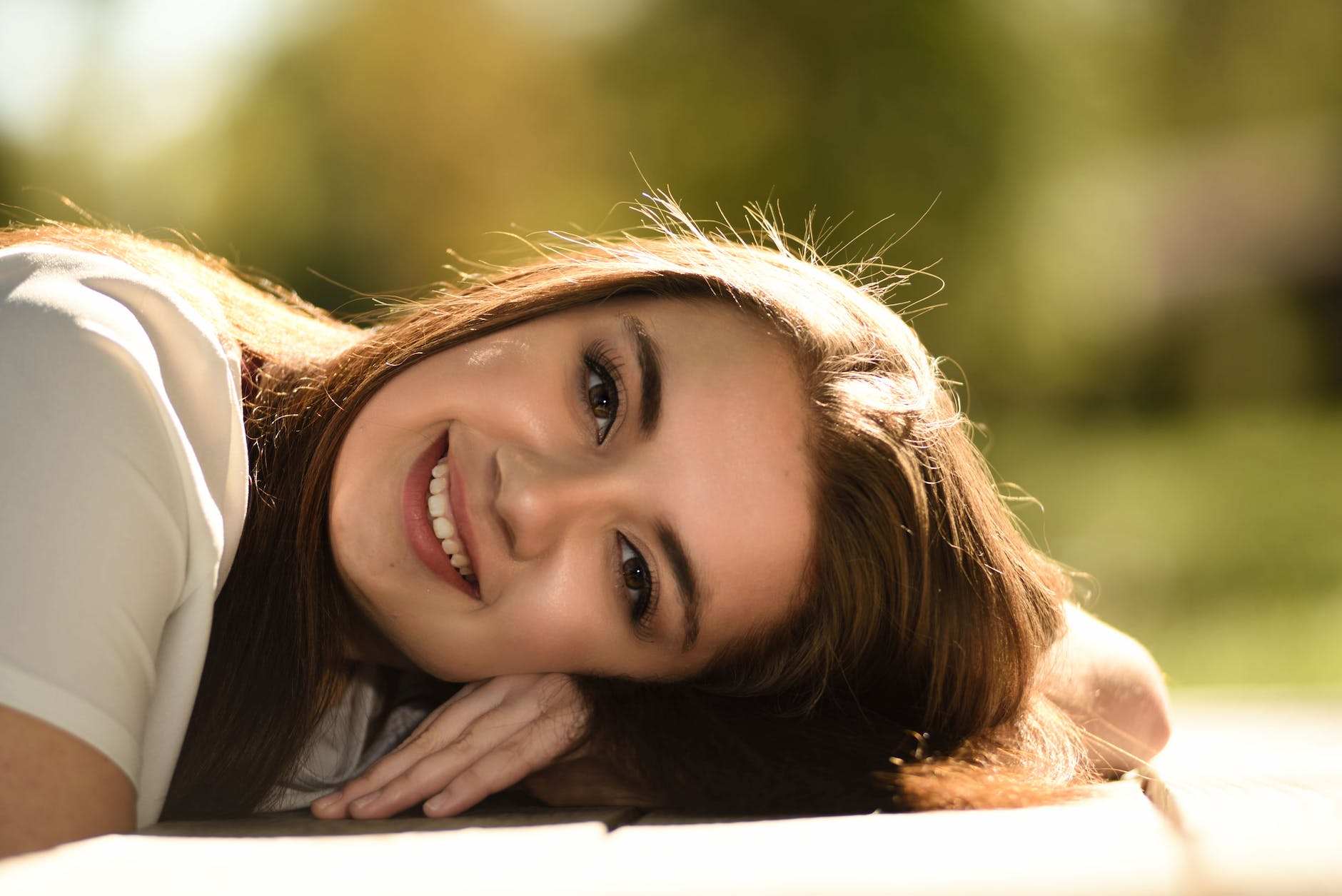 close up photography of woman laying on table