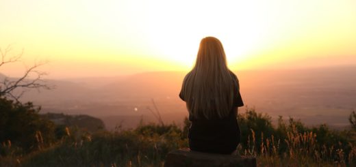 woman looking at sunset