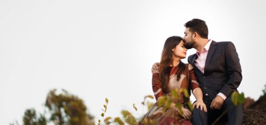 photo of a man kissing a woman on forehead