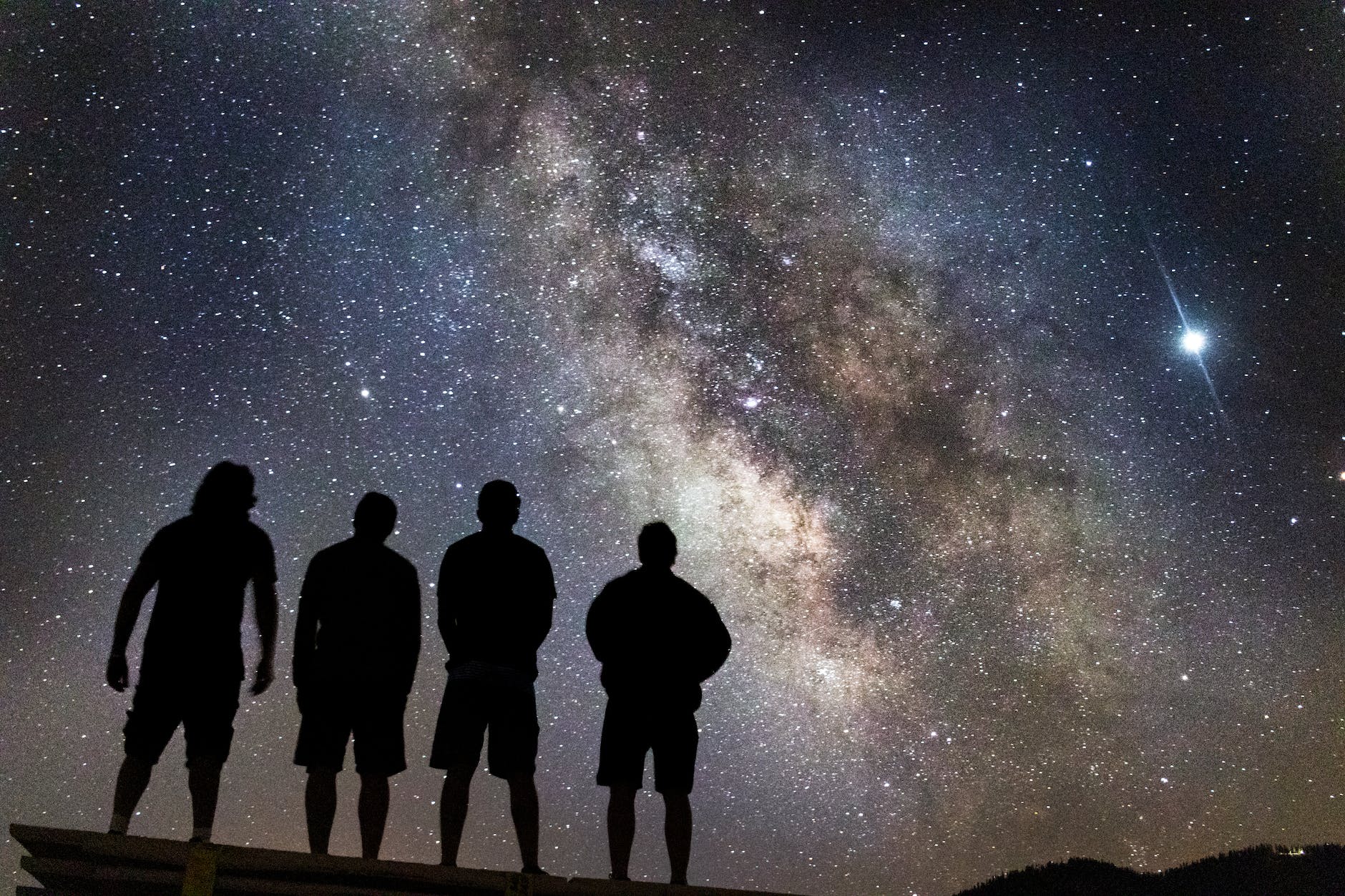 silhouette of people stargazing