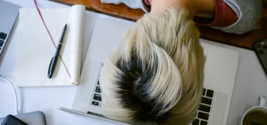 exhausted woman with head on keyboard