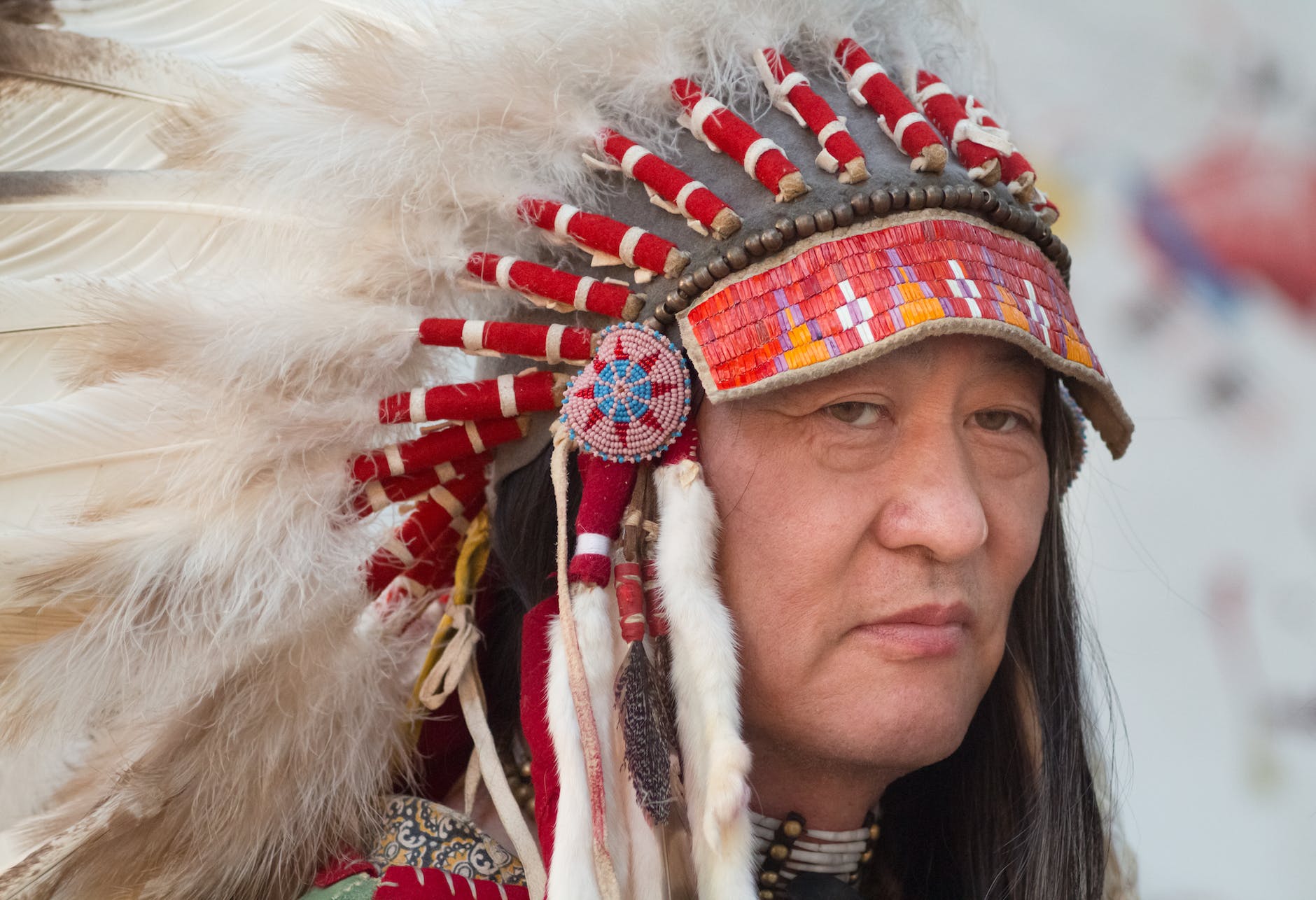 man in feather headdress