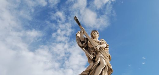 concrete statue under the blue sky