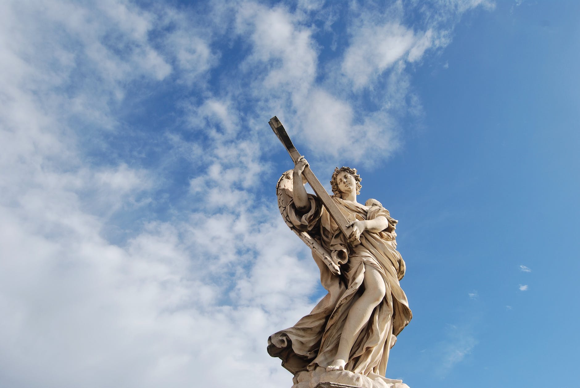 concrete statue under the blue sky