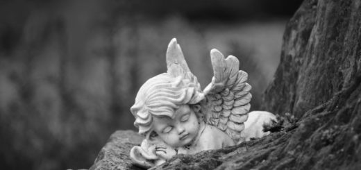 black and white photo of an angel figurine