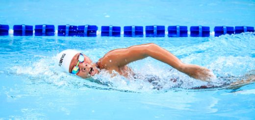 person swimming in body of water