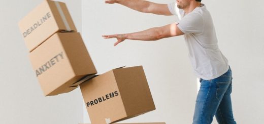 man falling carton boxes with negative words