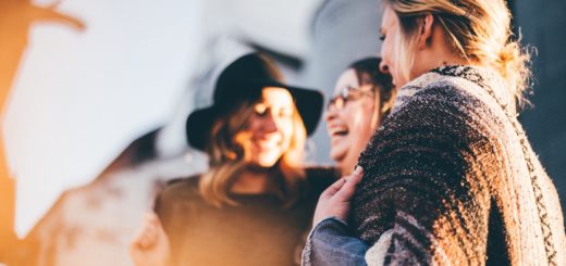 lightworkers laughing and talking outside during daytime