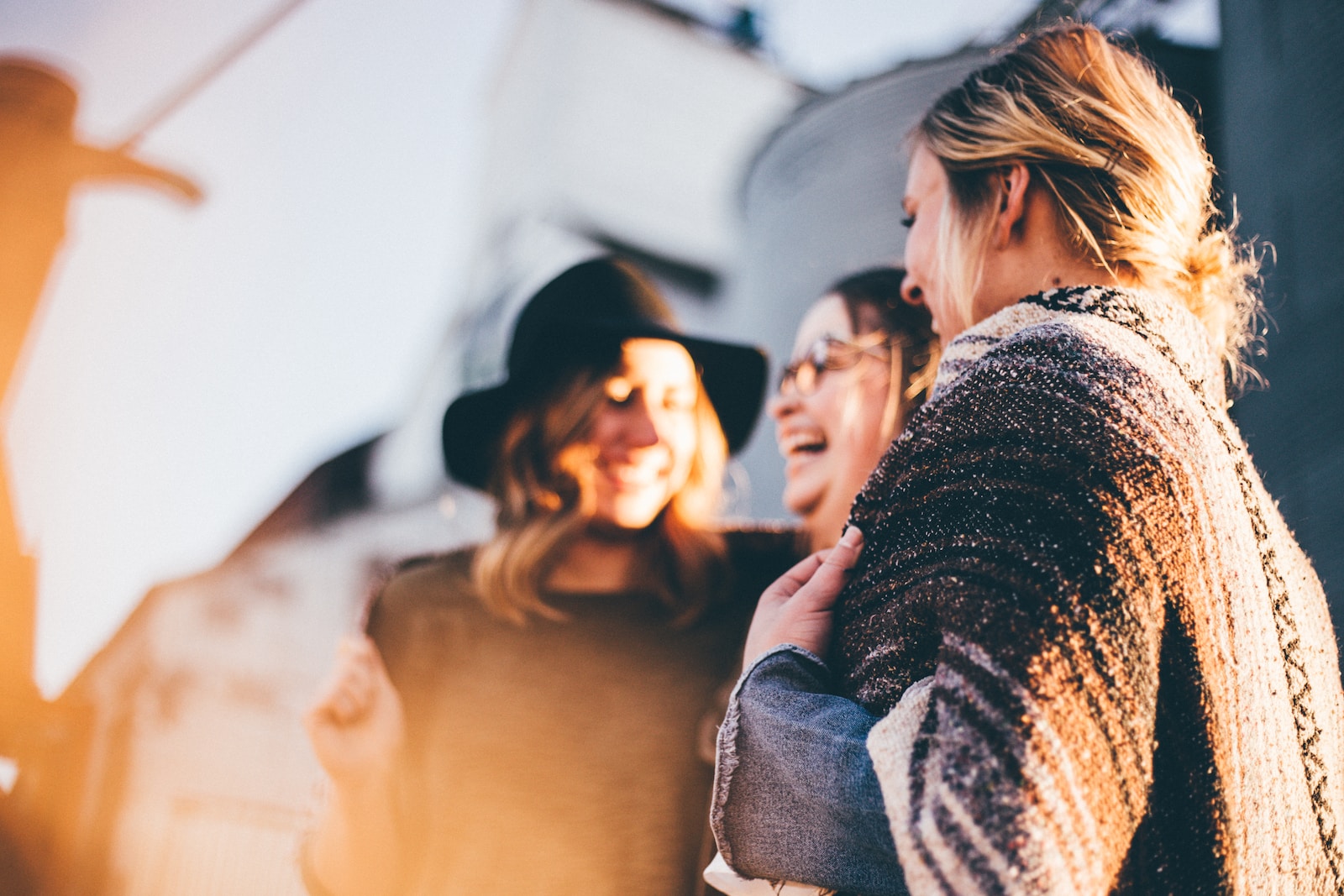 lightworkers laughing and talking outside during daytime