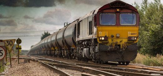 yellow and black train on railways