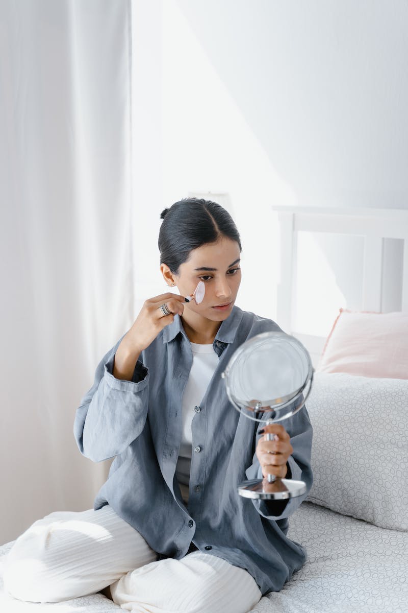 Woman using Jade Roller on her Face