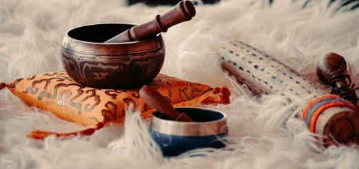 brown wooden mortar and pestle on white textile