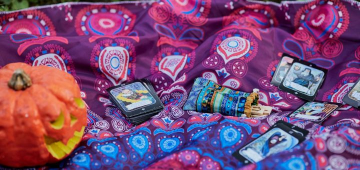 black smartphone on red and white textile