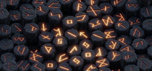 a pile of black rocks with orange letters on them