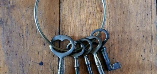 silver skeleton keys on brown wooden table