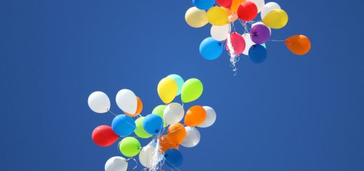 assorted-color balloons flying on sky during daytime