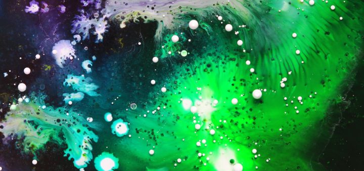 close-up photography of green, white, and purple paint splash